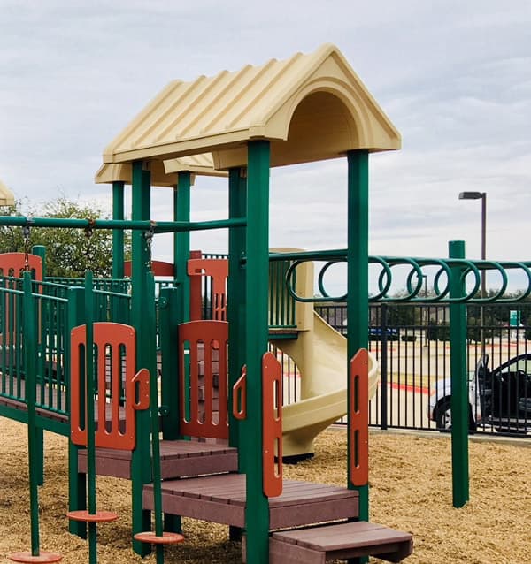 image of playground equipment with kiddie cushion